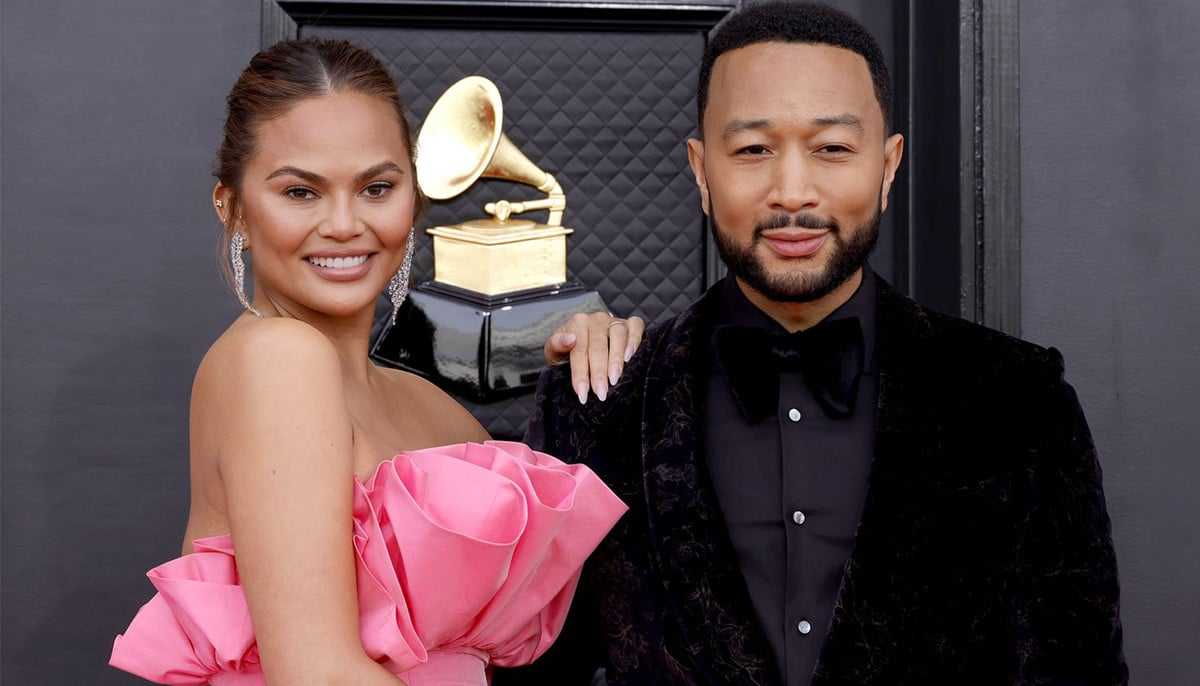John Legend Demonstrates Chivalry as Wife Chrissy Teigen Suffers Wardrobe Malfunction at AMAs