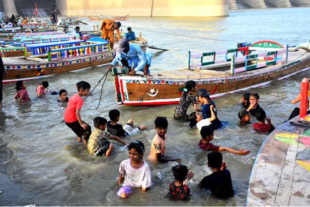 Eid-ul-Azha Celebrations: Children Seek Relief from Heat in Indus River