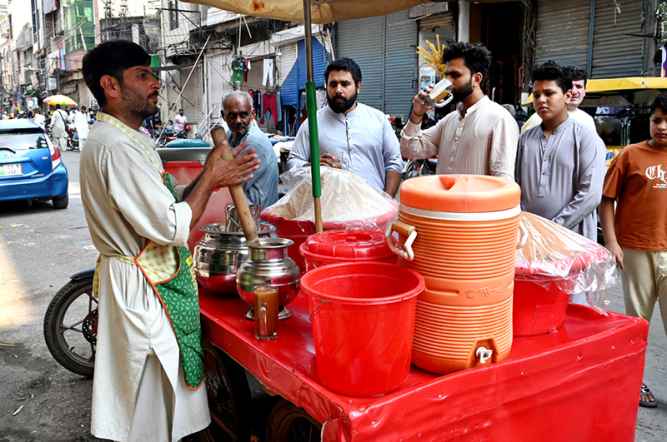 Street Vendor Offers Traditional Summer Drink Mix Sattu to Passersby